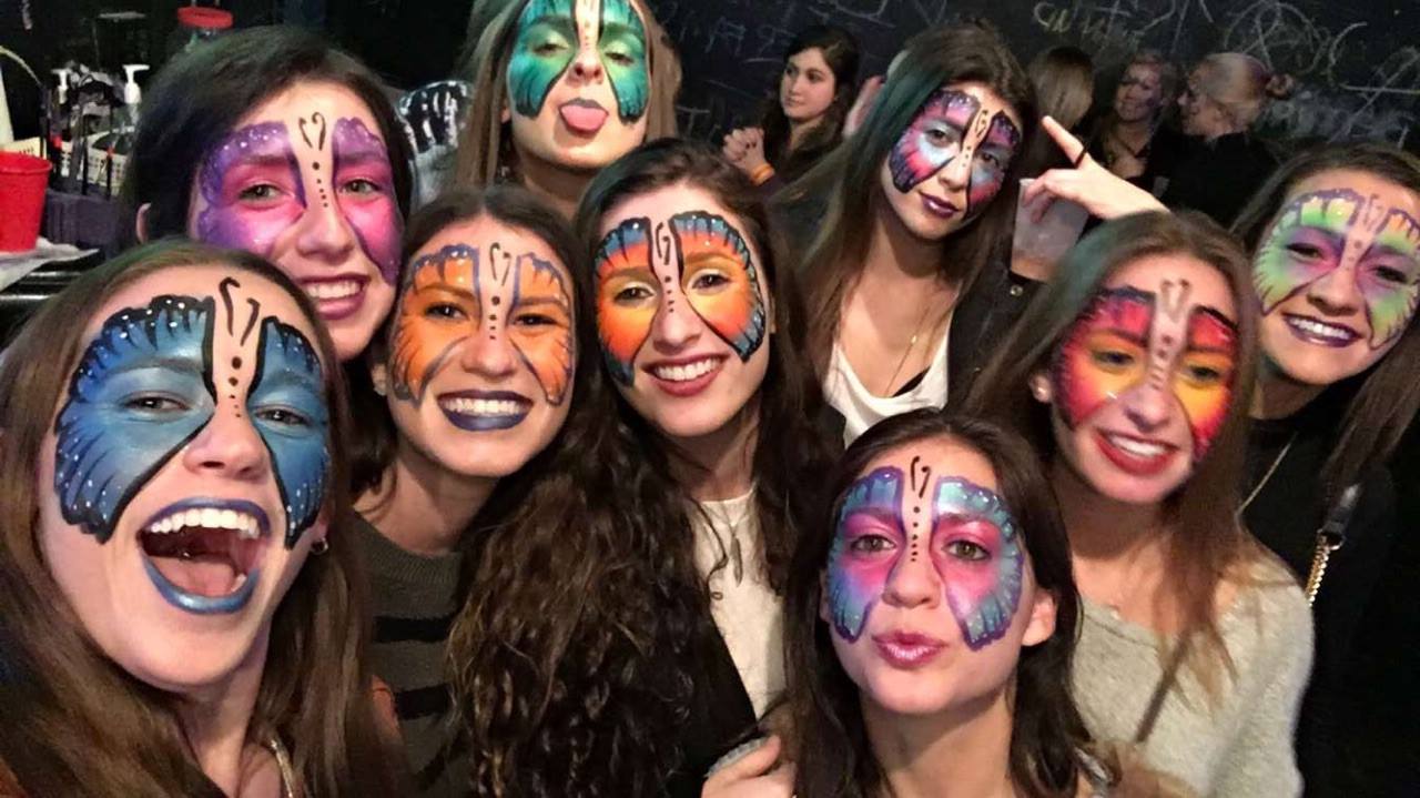 A group of people with face paint on their faces.