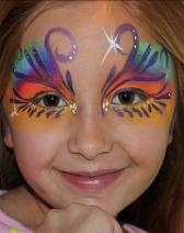 A girl with a face paint on her face.