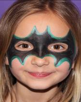 A girl with a batman mask on her face.