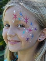 A girl with stars painted on her face.