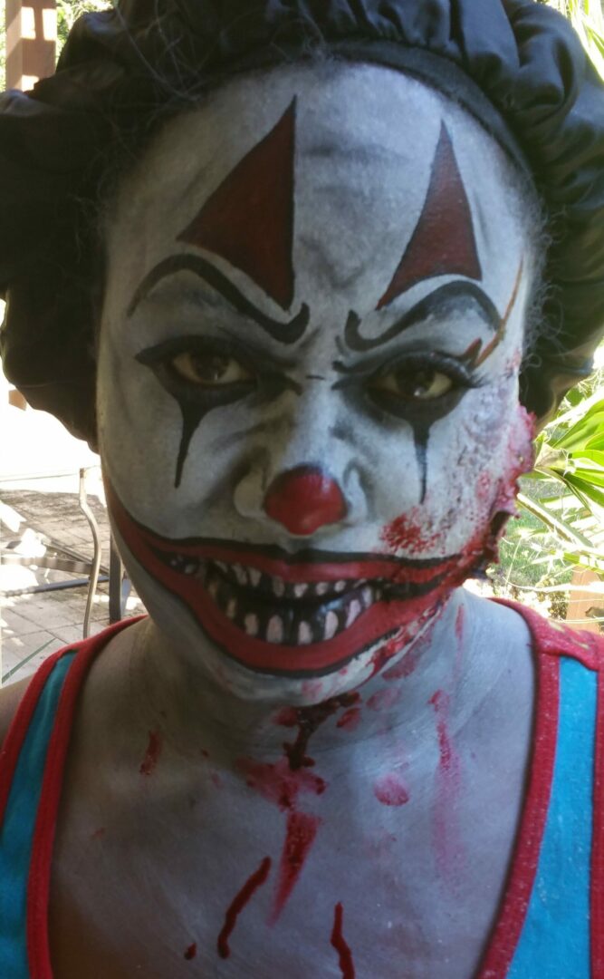 A person with scary clown makeup on.
