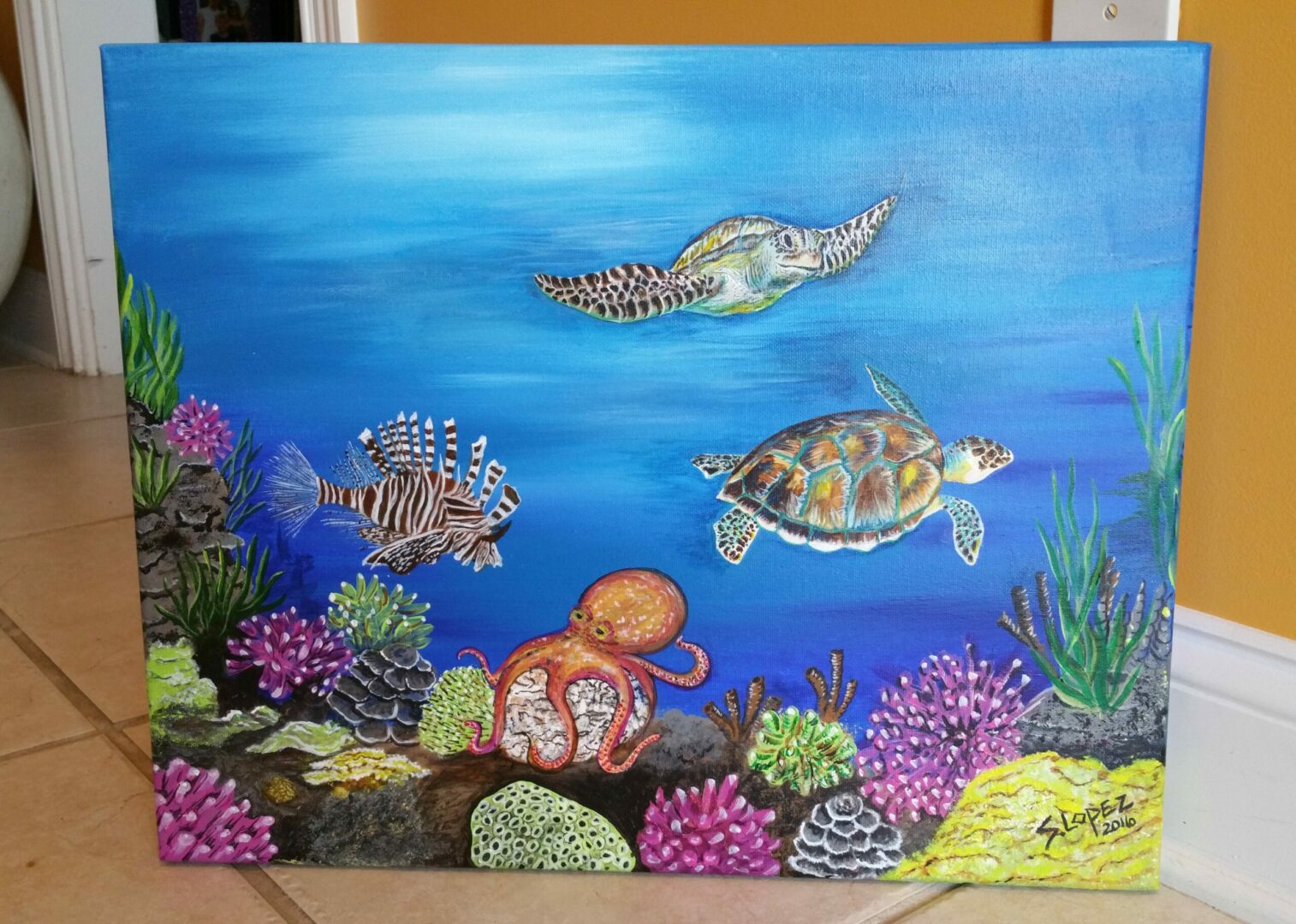 A painting of sea turtles swimming in the ocean.