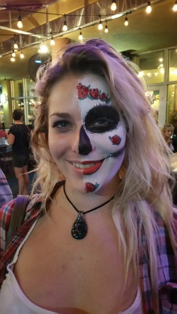 A woman with a face paint on her face.