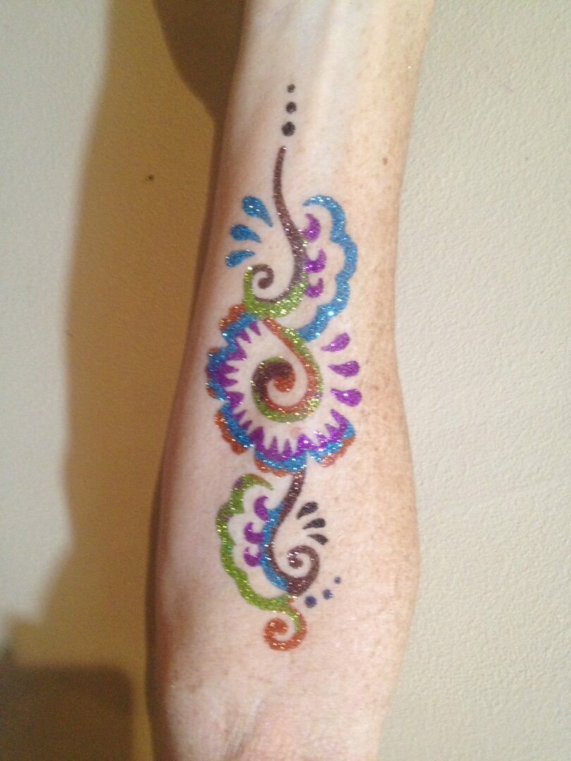 A person with a colorful tattoo on their arm.