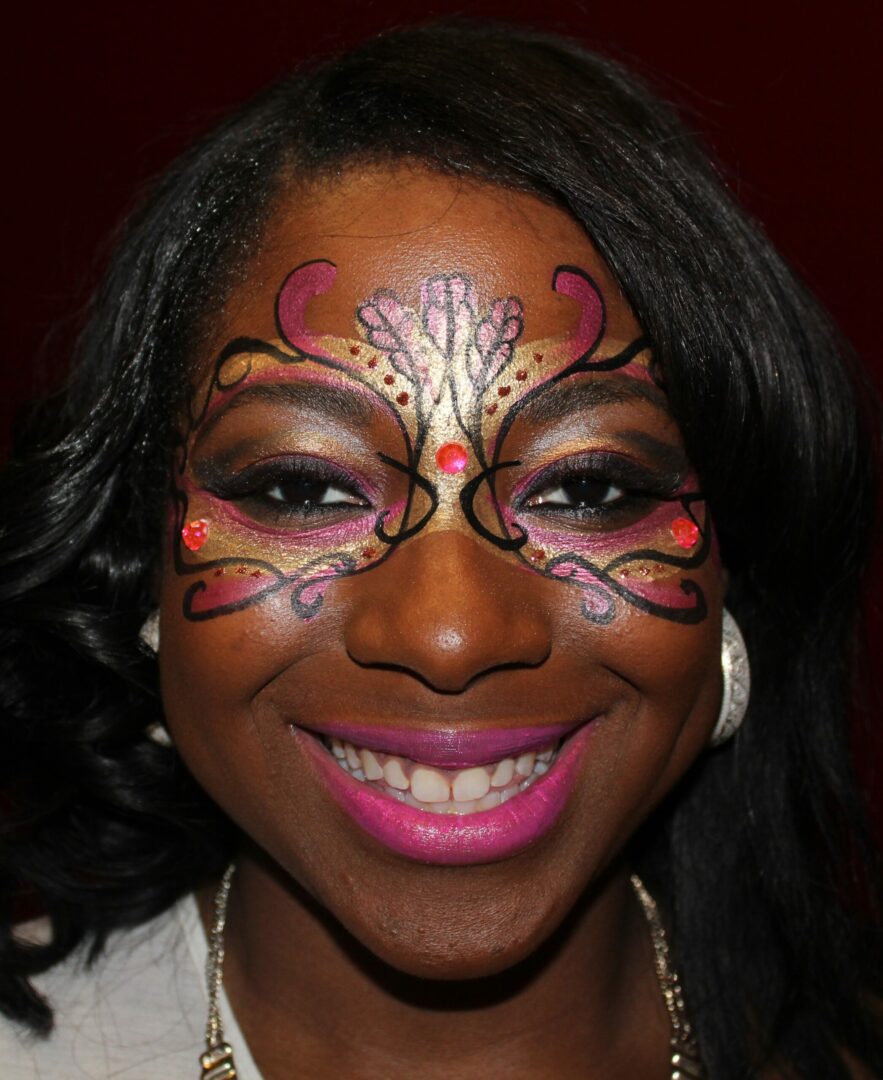 A woman with face paint on her face.