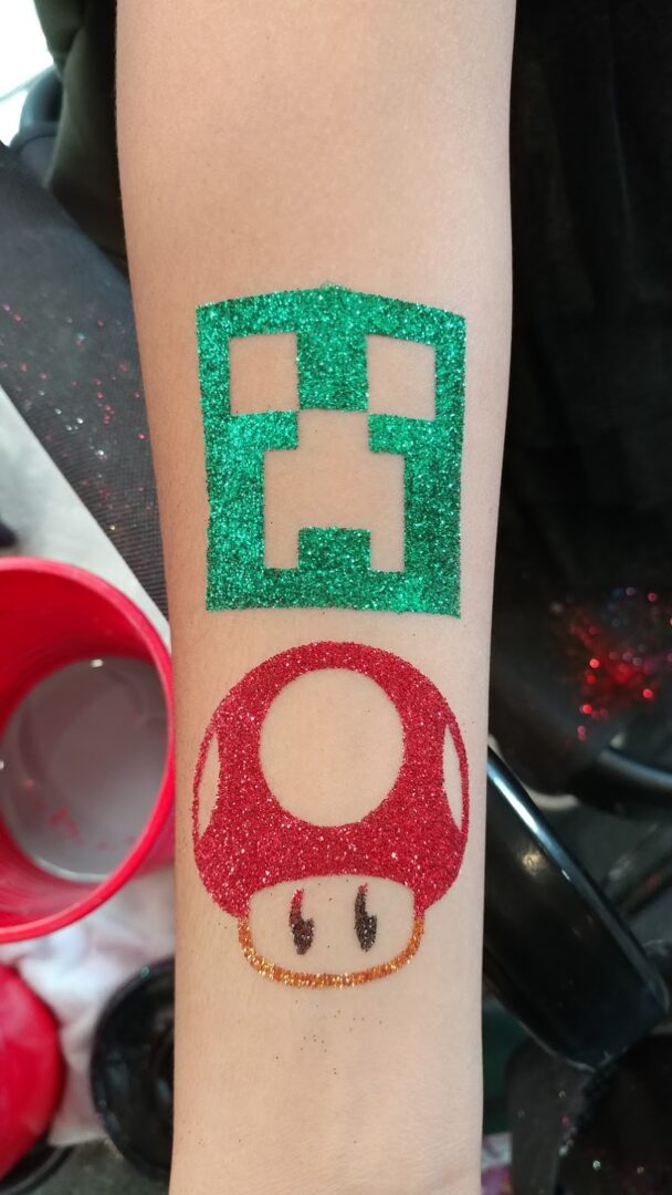 A green and red tattoo with a mushroom on it
