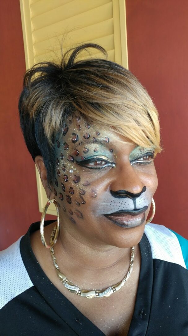 A woman with leopard makeup on her face.