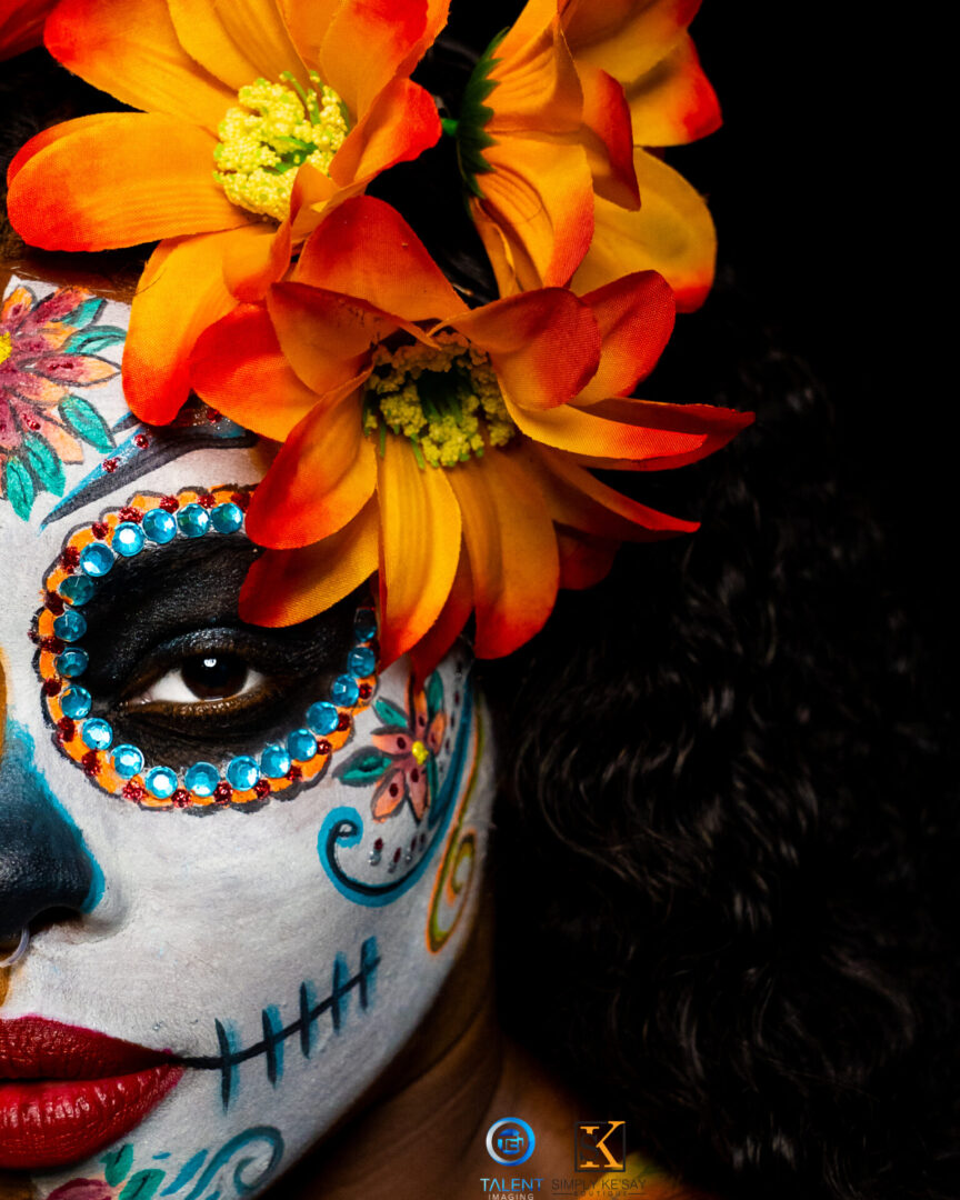 A woman with flowers in her hair and face paint.